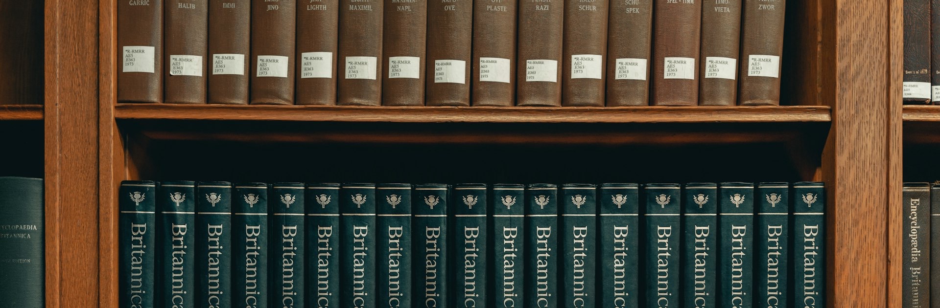 books on brown wooden shelf