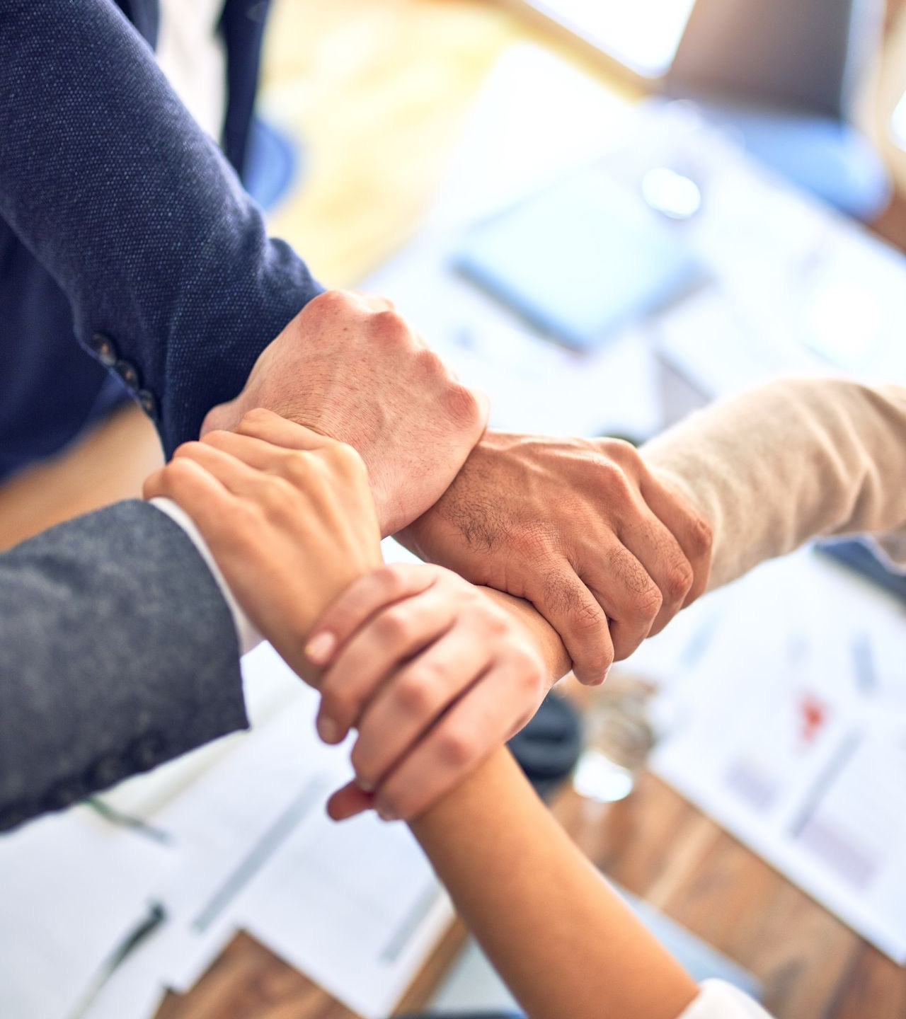 person in black long sleeve shirt holding persons hand